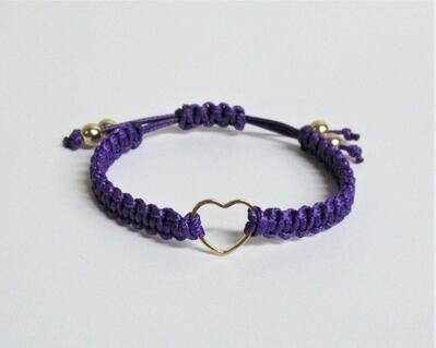 Macrame bracelet with small gold heart charm