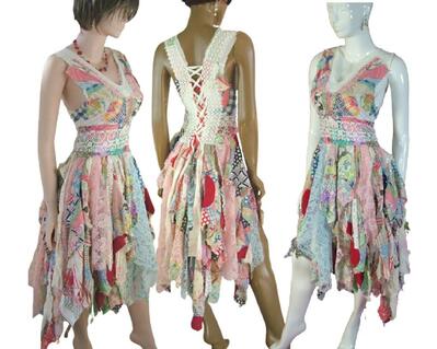 Patchwork dress made from vintage fabrics. Lots of colors with a lace up back. Tattered skirt with slight high low. One of a kind, hand made, eco-friendly boho style dress.