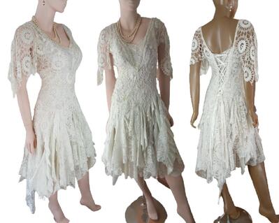 Off white crochet and tattered lace up wedding dress. Features wedding bling on the bodice and a lace up back for a snug fit around the waist. Unique dress.