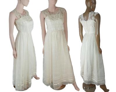 A vintage, reworked cream wedding dress. It has been repaired, cleaned and altered adding crochet style fabric over the shoulders and features the prettiest lace in the dress. One of a kind, hand made, eco-friendly bohemian style dress.