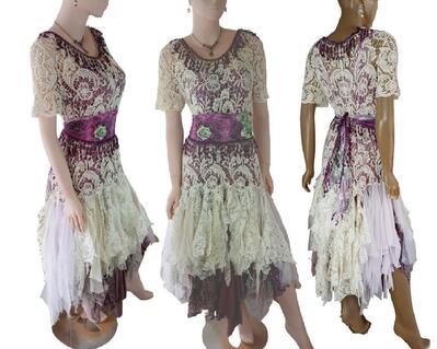 A plum purple and cream boho style dress. Low tatters at mid thigh and several colors. The bodice is crochet with fringe around the neckline and a tie up waist.