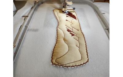 Machine embroidering the bacon design