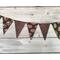 A gothic romance themed pennant banner tied with lace.  With gold, red, burgundy and black colors.