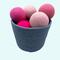 Pink dryer balls in basket