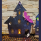 Large two layer haunted house with bat.