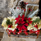 Christmas centerpiece with poinsettias and golden hydrangea