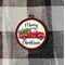 Red truck ornament with red and black check frame