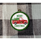 Red truck ornament with green and black check frame