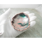free form copper enamel trinket dish in palm of hand