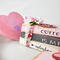 : Binding view of book stack and conversation heart