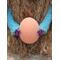 Bows on the hands holding the egg