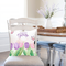Welcome spring pillow cover displayed on a pillow on a dining chair