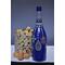 Hand painted blue bottle with various dot art/mandala designs around the entire bottle