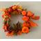 Another version of our Fall and Thalnksgiving wreaths.  This one has lots of gours , pumpkins, pincones, and leaves accenting.  Large organe fabric with gold weaved throughout.