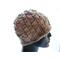 Mannequin wears a knitted beanie in hand-dyed merino wool yarn in neutral tans.  The deep brim has a rolled edge and the sides of the hat have a pattern of  basketweave stitches.