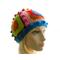 Mannequin wears a one-of-a-kind 5-Square Beanie created with scrap yarn in bright colors.