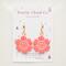 Pink and white smiley face flower earrings on a white card