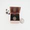 photo of tiny trinket box with lid up and dime inside