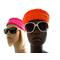 Mannequins in pillbox-inspired hats in orange (front) and hot pink (back).  Both are wearing sunglasses.