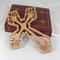 This Ten-Inch Rustic Fretwork Christian Cross Wall Hanging Art is handcrafted from reclaimed wood. Its intricate fretwork design adds unique texture and character, blending rustic charm with elegant design. It is a perfect focal point for any room.
