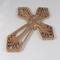 This Ten-Inch Rustic Fretwork Christian Cross Wall Hanging Art is handcrafted from reclaimed wood. Its intricate fretwork design adds unique texture and character, blending rustic charm with elegant design. It is a perfect focal point for any room.