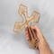 This Ten-Inch Rustic Fretwork Christian Cross Wall Hanging Art is handcrafted from reclaimed wood. Its intricate fretwork design adds unique texture and character, blending rustic charm with elegant design. It is a perfect focal point for any room.