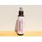10 ml dark colored bottle standing upright with cap off, showing stainless roller ball. Product is for menstrual cramp relief.