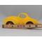 Handmade wooden toy car vintage style of a fat fendered coupe painted bright yellow with nonmarring amber shellac finished wheels. It is an excellent push toy for a younger child.