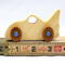 Handmade wooden toy bat car with a clear and amber shellac finish and metallic sapphire blue trim, part of my Play Pal Collection
