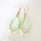 Green gemstone beaded dangle earrings, with gold crystal accents.