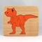 Handmade Wood Dinosaur Tray Puzzle with Amber Shellac and Orange Paint Finish. Freestanding and Versatile Toy for Kids of All Ages, Crafted in the USA with Traditional Woodworking Tools.