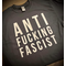 Black t-shirt with big block letters in white vinyl spelling out ANTI FUCKING FASCIST stacked on top of one another.
