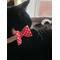 Tink the Tuxedo Cat Wearing Red Polka Dot Bow Collar.