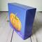 Photo of small square canvas painting of orange pumpkin with purple blue background