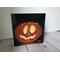 Photo of small square canvas painting of glowing jack o'lantern pumpkin with a black background