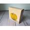 Photo of small square canvas painting of orange pumpkin with peach colored background