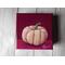 Photo of small square canvas painting of peach colored pumpkin with a raspberry pink background