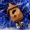 Handmade Wood Birdhouse Ornament Collectable Christmas Tree Ornament shapeed like a Christmas tree. Made from select-grade hardwoods, hand-sanded, and finished with a custom blend of oils and waxes using traditional woodworking tools.