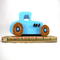 This handmade wooden toy car, modeled after a 1927 Ford T-Coupe, is hand-painted baby blue with black and metallic sapphire blue. The wheels are finished with nonmarring amber shellac.