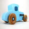 This handmade wooden toy car, modeled after a 1927 Ford T-Coupe, is hand-painted baby blue with black and metallic sapphire blue. The wheels are finished with nonmarring amber shellac.