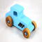 This handmade wooden toy car, modeled after a 1927 Ford T-Coupe, is hand-painted baby blue with black and metallic sapphire blue. The wheels are finished with nonmarring amber shellac.