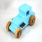 This handmade wooden toy car, modeled after a 1927 Ford T-Coupe, is hand-painted baby blue with black and metallic sapphire blue. The wheels are finished with nonmarring amber shellac.