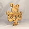 A handcrafted octopus puzzle made from wood. The puzzle is freestanding and can comfortably sit on a shelf, table, window sill, or door frame.