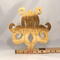 A handcrafted octopus puzzle made from wood. The puzzle is freestanding and can comfortably sit on a shelf, table, window sill, or door frame.