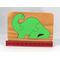 Handmade three-piece wooden dinosaur tray puzzle finished with amber shellac and green acrylic paint.