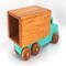 This handmade wooden toy truck is a box truck or moving van, painted in your choice of several colors. The wheels and body of the truck are finished with shellac.
