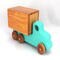 This handmade wooden toy truck is a box truck or moving van, painted in your choice of several colors. The wheels and body of the truck are finished with shellac.