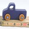 Handmade wooden toy pickup truck handmade and painted navy blue with amber shellac wheels and metallic sapphire blue trim. It's a little blue truck from my Play Pal Collection.