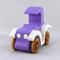 A handmade wooden toy car vintage style coupe painted nontoxic purple and white with spoked wheels finished with nonmarring amber shellac, from my  Bad Bob's Custom Motors Collection.