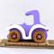 A handmade wooden toy car vintage style coupe painted nontoxic purple and white with spoked wheels finished with nonmarring amber shellac, from my  Bad Bob's Custom Motors Collection.